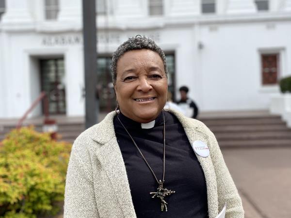 Rev. Carolyn Foster stands outside the Alabama state house
